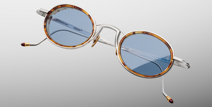 Jacques Marie Mage Varda Cairo ovale Luxus-Sonnebrille mit silbernem Rahmen und blauen Gläsern
