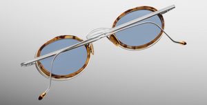 Jacques Marie Mage Varda Cairo ovale Luxus-Sonnebrille mit silbernem Rahmen und blauen Gläsern