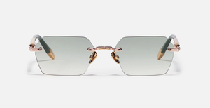 John Dalia R03 | C432 - Luxussonnenbrille mit rosegoldenem Rahmen und grauen Gläsern.