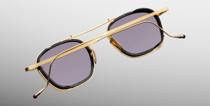 jacques marie mage baudelaire 2 ebony eckige sonnenbrille aus titan und acetat in gold und schwarz marmoriert mit grau blauen gläsern