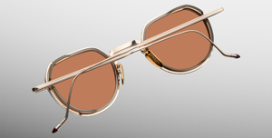 jacques marie mage dixon darjeeling pantoförmige sonnenbrille aus titan und acetat in gold und taupe mit orangenen gläsern