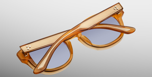 jacques marie mage dr.dream marigold ovale sonnenbrille in transparentem orange mit hellblauen gläsern