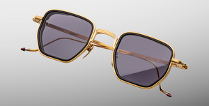 jacques marie mage atkins gold eckige sonnenbrille in gold und schwarz mit violetten gläsern