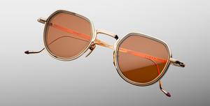 jacques marie mage dixon darjeeling pantoförmige sonnenbrille aus titan und acetat in gold und taupe mit orangenen gläsern