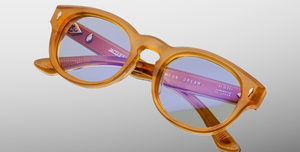 jacques marie mage dr.dream marigold ovale sonnenbrille in transparentem orange mit hellblauen gläsern