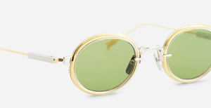 Sato Acamar II P/YG-1 ovale sonnenbrille aus titan in gold und platinum mit grünen gläsern