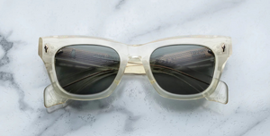 jacques marie mage dealan brut eckige sonnenbrille in transparent mit grünen gläsern