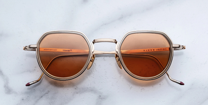 jacques marie mage dixon darjeeling pantoförmige sonnenbrille aus titan und acetat in gold und taupe mit orangenen gläsern