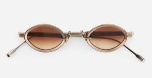 sato talita ag/mb-1 ovale sonnenbrille aus titan in gold und braun mit braunen verlaufsgläsern