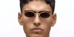 kuboraum Z24 GG ovale sonnenbrille aus metall in gold mit grauen und gold verspiegelten gläsern