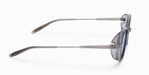 akoni astria crystal grey ovale sonnenbrille aus titan und acetat in silber und grau mit blauen verspiegelten gläsern