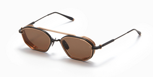akoni eris-two brushed black ovale sonnenbrille in matt schwarz und golg mit braunen gläsern