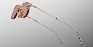 jacques marie mage fonda sweetheart eckige randlose sonnenbrille aus titan in rosegold und orangenen gläsern