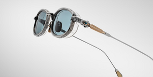 jacques marie mage last frontier hardin gaia ovale sonnenbrille in silber und gold mit transparenten Acetat und hellblauen gläsern