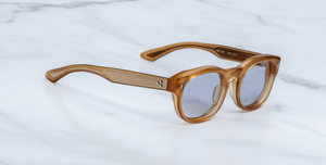 jacques marie mage dr.dream marigold ovale sonnenbrille in transparentem orange mit hellblauen gläsern