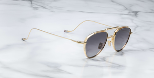jacques marie mage flynn cia aviator sonnenbrille aus titan in gold mit grauen verlaufsgläsern