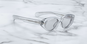 jacques marie mage krasner sulfur ovale sonnenbrille in transparent mit grauen gläsern