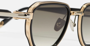 John Dalia Richy | C409 - Luxussonnenbrille mit goldenem Rahmen und graune Gläsern aus Titan.