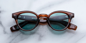 Jacques Marie Mage Clemens Hickory - Luxussonnenbrille, handgemacht in Japan mit braunem Bügel und türkisen Gläsern