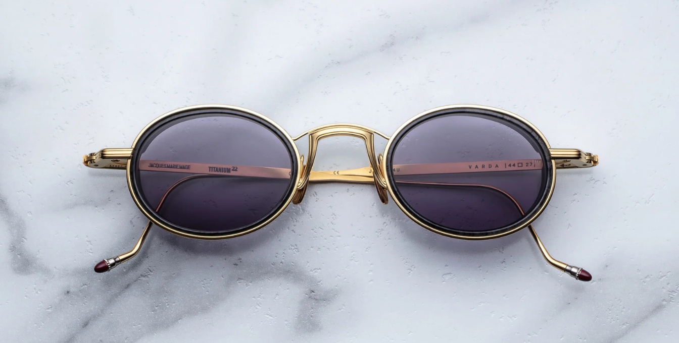 Jacques Marie Mage Varda | Ebony ovale Luxus-Sonnenbrille mit goldenem Rahmen und lila Gläsern