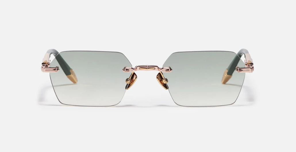 John Dalia R03 | C432 - Luxussonnenbrille mit rosegoldenem Rahmen und grauen Gläsern.