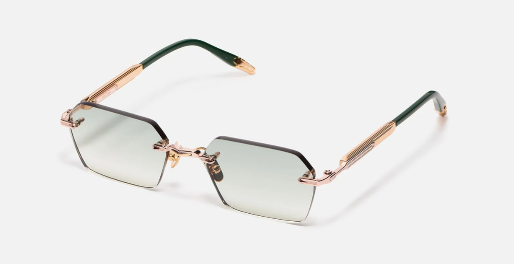 John Dalia R03 | C432 - Luxussonnenbrille mit rosegoldenem Rahmen und grauen Gläsern.
