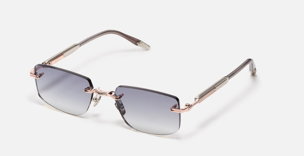 John Dalia R04 | C476 - Luxussonnenbrille mit roségoldenem Rahmen und grauen Gläsern.