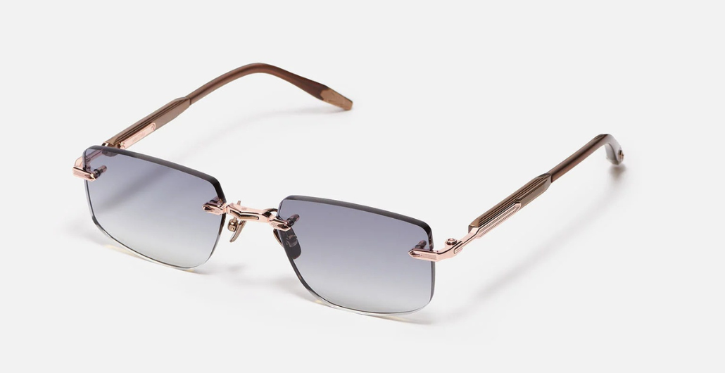 John Dalia R04 | C440 - Luxussonnenbrille mit roségoldenem Rahmen und grauen Gläsern.