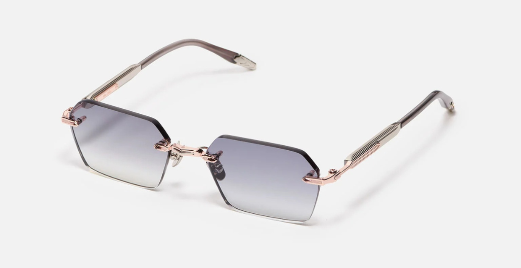 John Dalia R03 | C440 - Luxussonnenbrille mit Roségold Rahmen und grauen Gläsern.