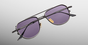 jacques marie mage cendrars corbeau sonnenbrille aus titan in schwarz mit grauen gläsern
