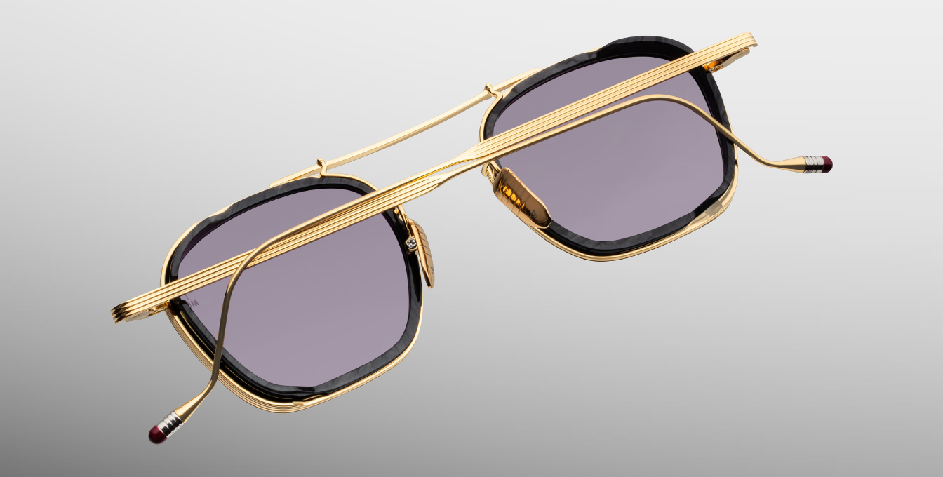 jacques marie mage baudelaire 2 ebony eckige sonnenbrille aus titan und acetat in gold und schwarz marmoriert mit grau blauen gläsern