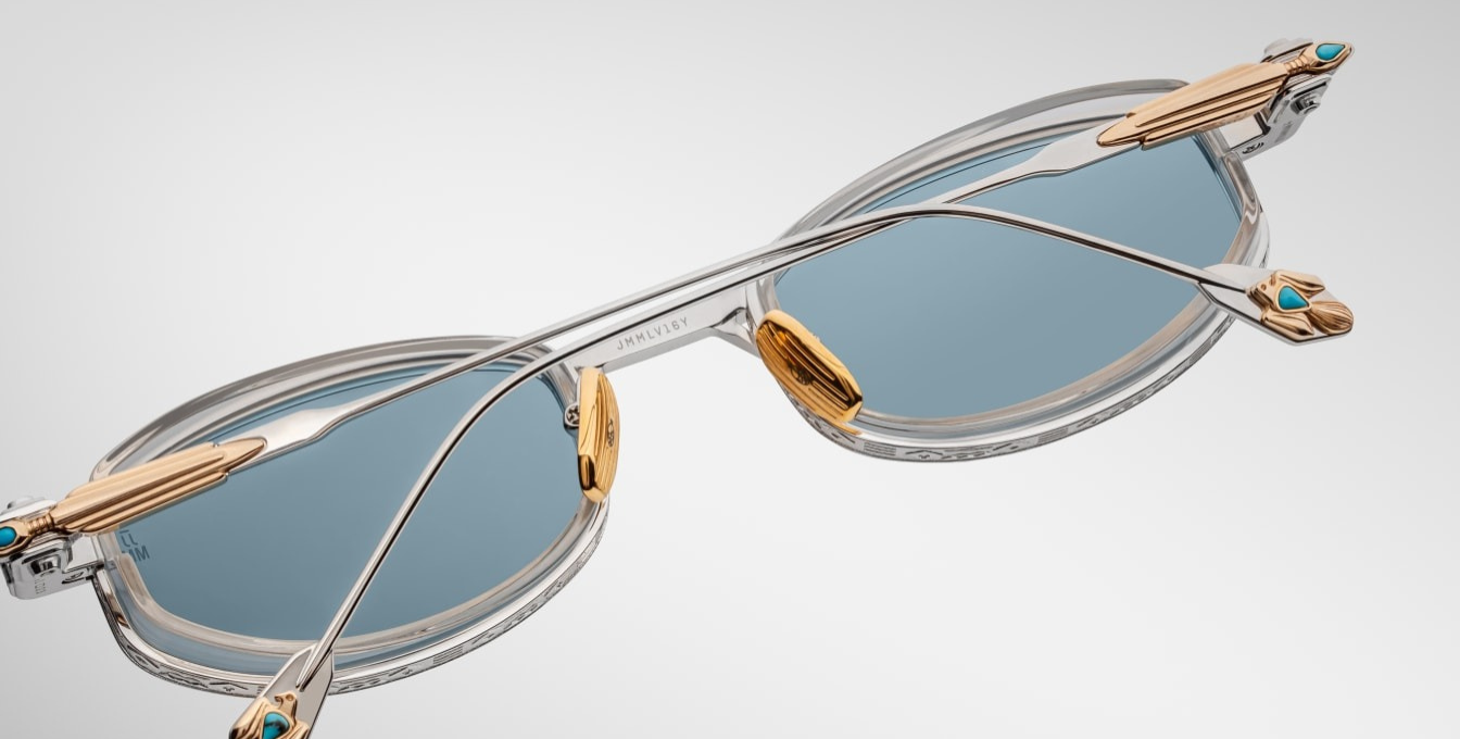 jacques marie mage last frontier hardin gaia ovale sonnenbrille in silber und gold mit transparenten Acetat und hellblauen gläsern