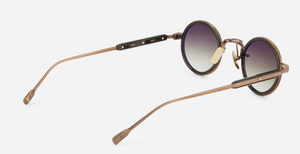 sato naos ab/o-1 ovale sonnenbrille aus titan und acetat in bronze und olive mit grün verlaufenden gläsern