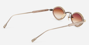 sato talita ag/mb-1 ovale sonnenbrille aus titan in gold und braun mit braunen verlaufsgläsern