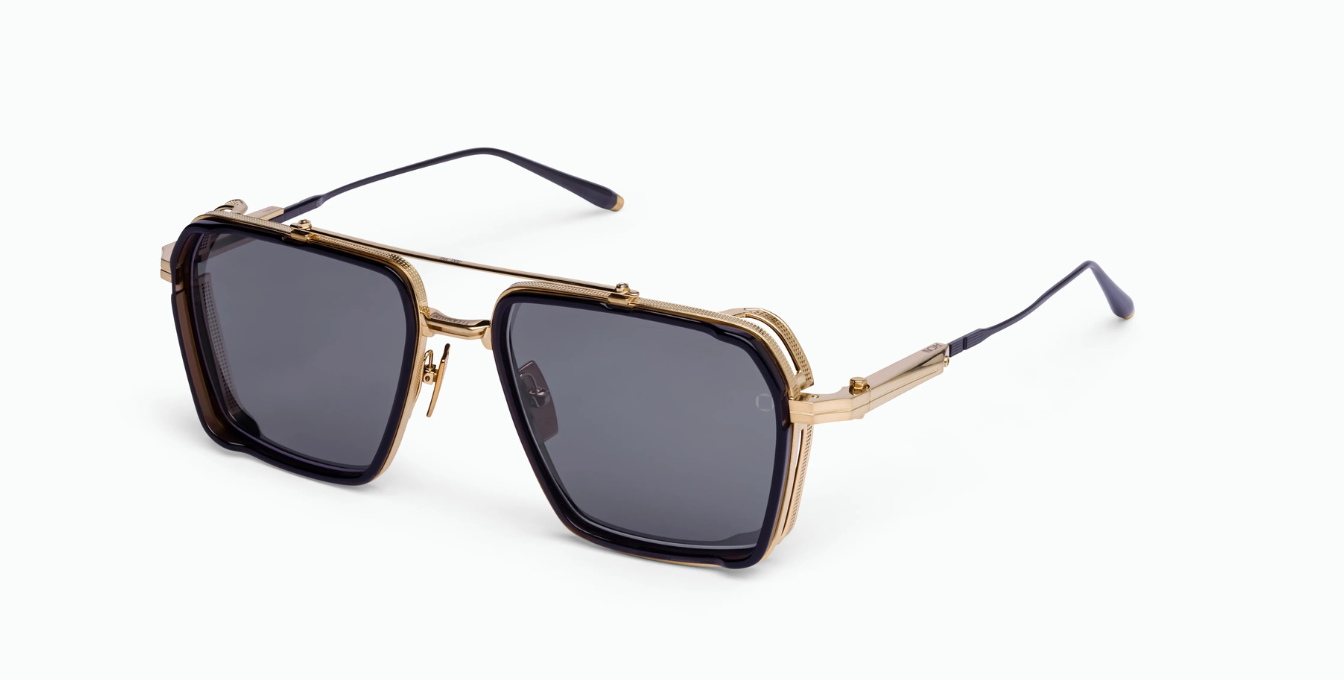 akoni tiros brushed gold eckige sonnenbrille in gold und schwarz mit grauen gläsern