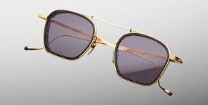 jacques marie mage baudelaire 2 ebony eckige sonnenbrille aus titan und acetat in gold und schwarz marmoriert mit grau blauen gläsern