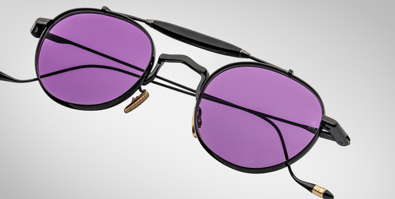 jacques marie mage dasan spider ovale sonnenbrille in schwarz mit violetten gläsern