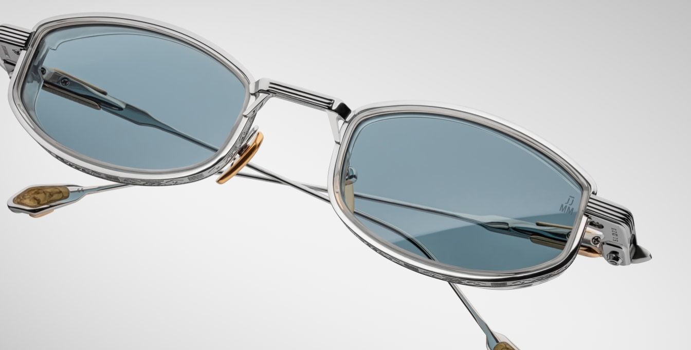 jacques marie mage last frontier hardin gaia ovale sonnenbrille in silber und gold mit transparenten Acetat und hellblauen gläsern