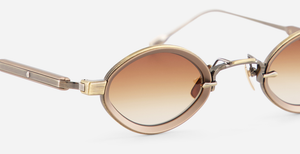 sato talita ag/mb-1 ovale sonnenbrille aus titan in gold und braun mit braunen verlaufsgläsern