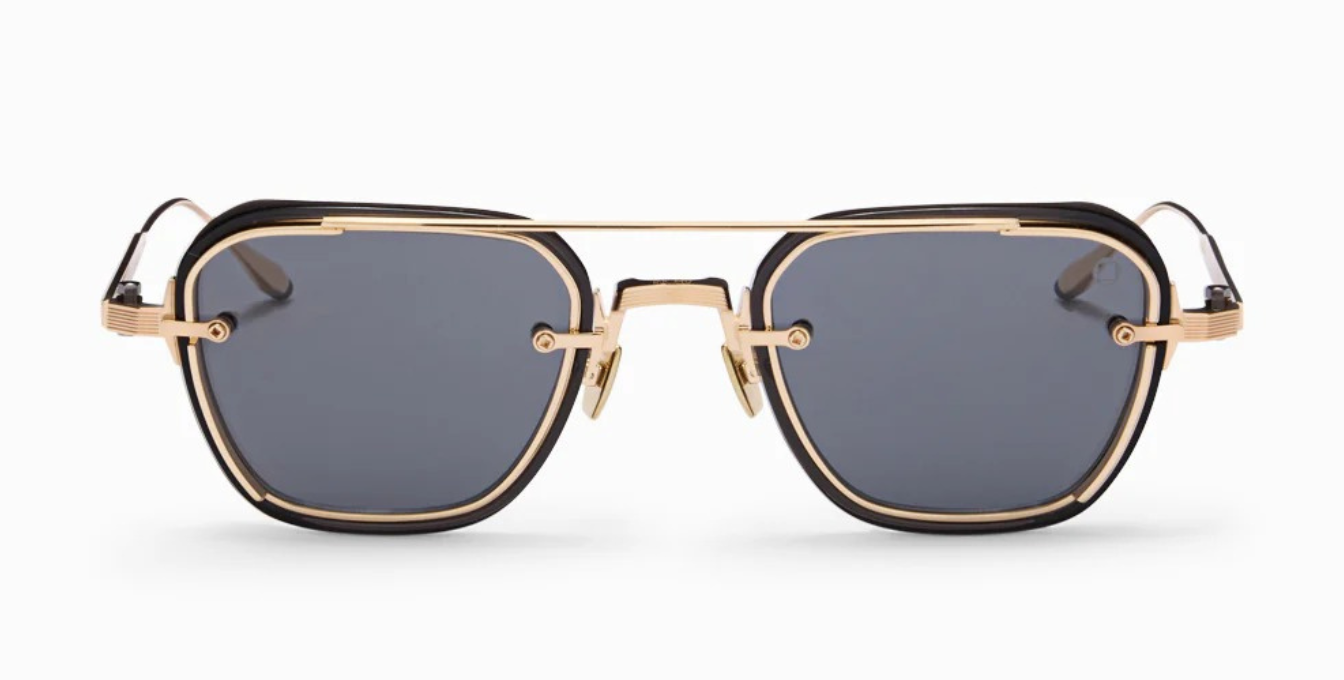 akoni jura crystal black ckige sonnenbrille in schwarz und gold mit grauen gläsern