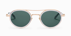 akoni astria crystal clear ovale sonnenbrille aus titan und acetat in transparent und gold mit grünen gläsern