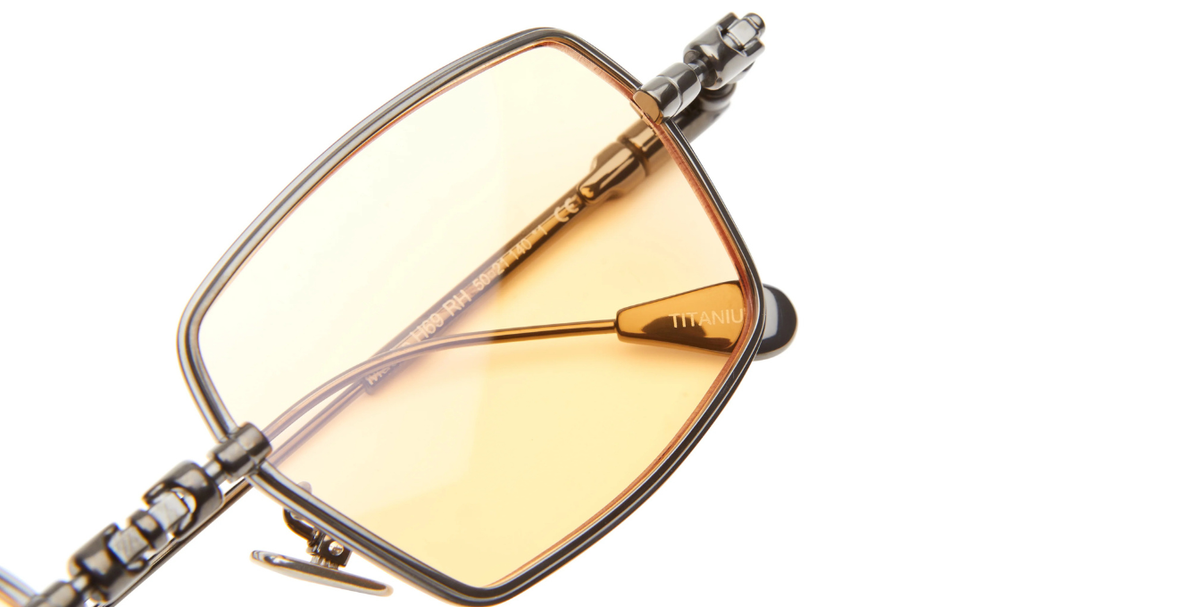 kuboraum h69 rh eckige titansonnenbrille in gunmetal mit hell orangenen gläsern