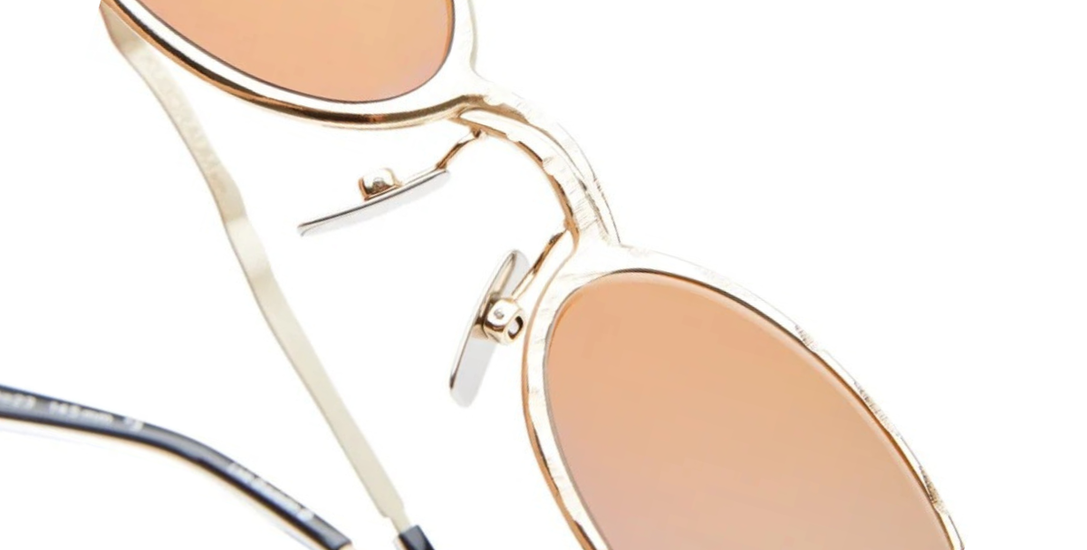 kuboraum Z24 GG ovale sonnenbrille aus metall in gold mit grauen und gold verspiegelten gläsern