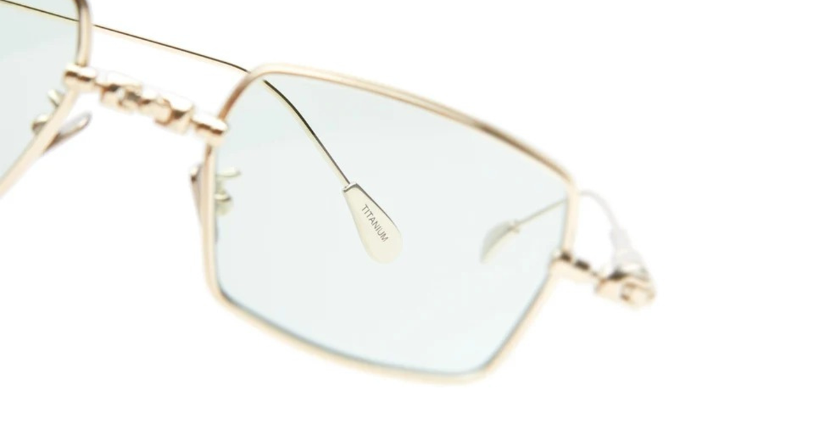 kuboraum H69 LG eckige Titansonnenbrille in gold mit hellgrpnen gläsern