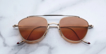 jacques marie mage flynn darjeeling aviator sonnenbrille aus titan in gold mit orangenen gläsern