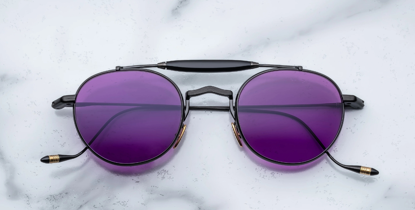 jacques marie mage dasan spider ovale sonnenbrille in schwarz mit violetten gläsern