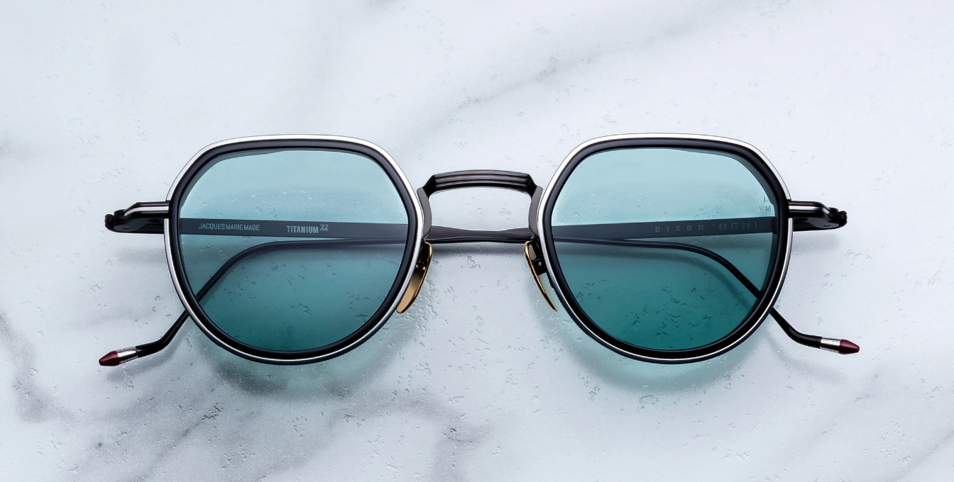 jacques marie mage dixon paon pantoförmige sonnenbrille aus titan und acetat in schwarz und silber mit türkisenen Gläsern