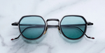 jacques marie mage dixon paon pantoförmige sonnenbrille aus titan und acetat in schwarz und silber mit türkisenen Gläsern