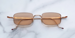 jacques marie mage dusk sweetheart eckige sonnenbrille aus titan in rosegold mit orangenen gläsern