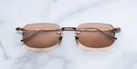 jacques marie mage fonda sweetheart eckige randlose sonnenbrille aus titan in rosegold und orangenen gläsern